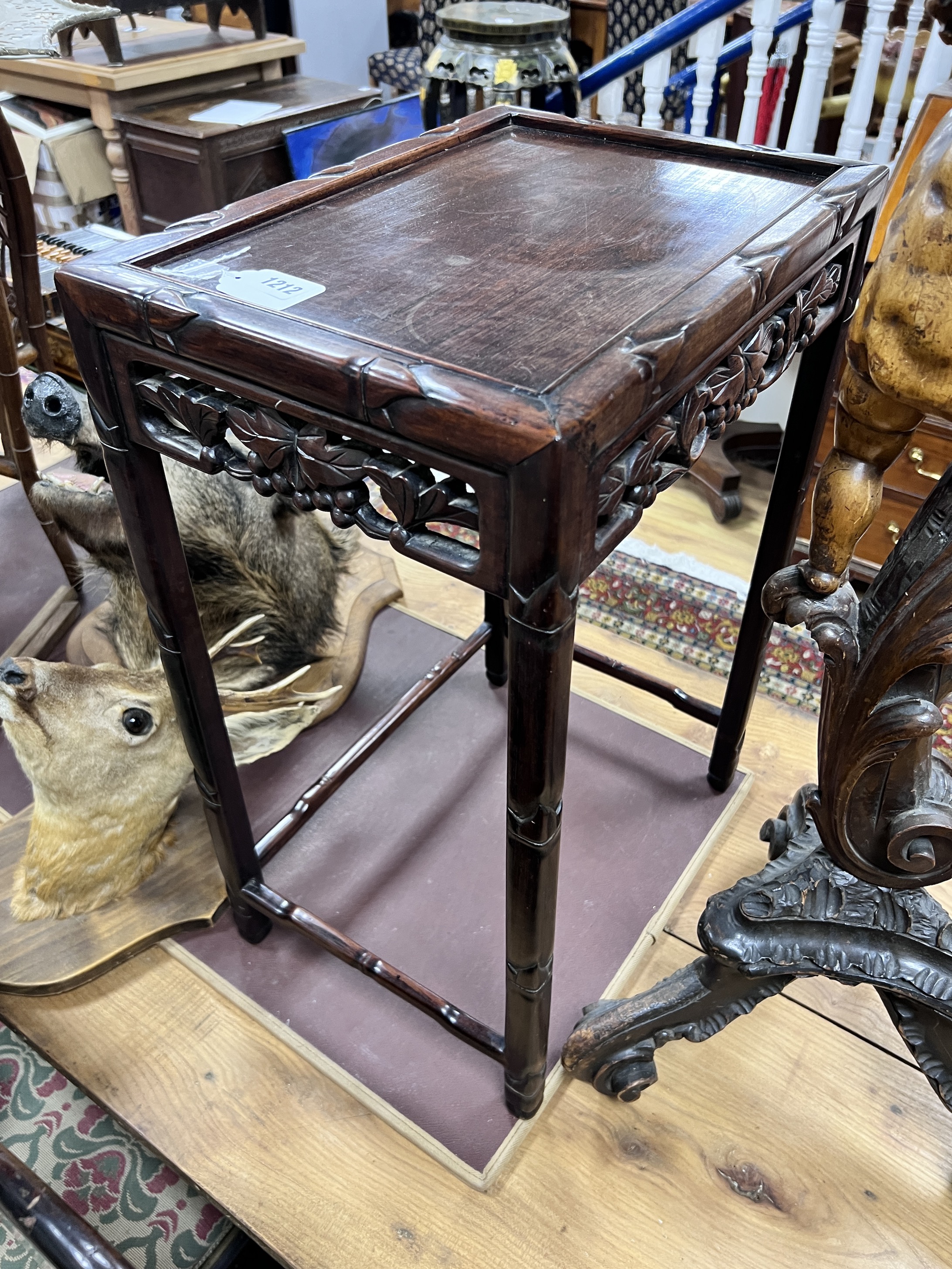 A Chinese hongmu occasional table from a nest, width 43cm